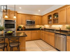 A kitchen with wooden cabinets and a black countertop.