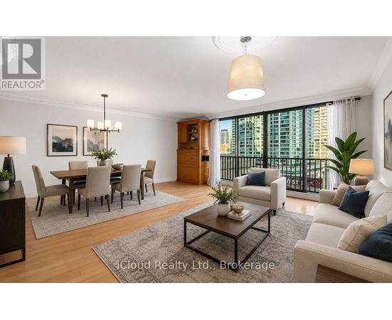 A well-lit living room with a dining area and a balcony overlooking the city.