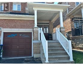 A house with a brown garage door and a white porch.
