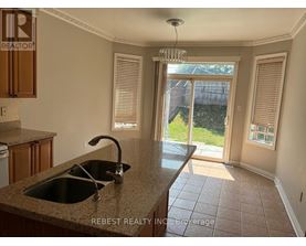 A kitchen with a sink and a window.