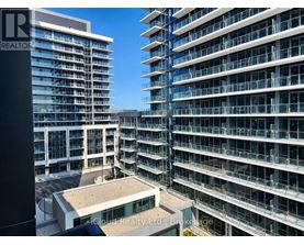 A view of a building with a balcony and a sign that says "REALTOR".