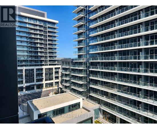 A view of a building with a balcony and a sign that says "REALTOR".