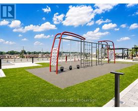 A playground with a red swing set and a slide.