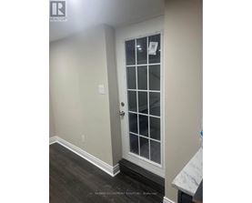 A white door with a glass panel and a handle.