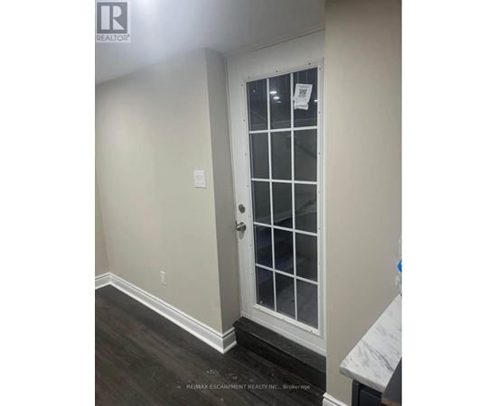 A white door with a glass panel and a handle.
