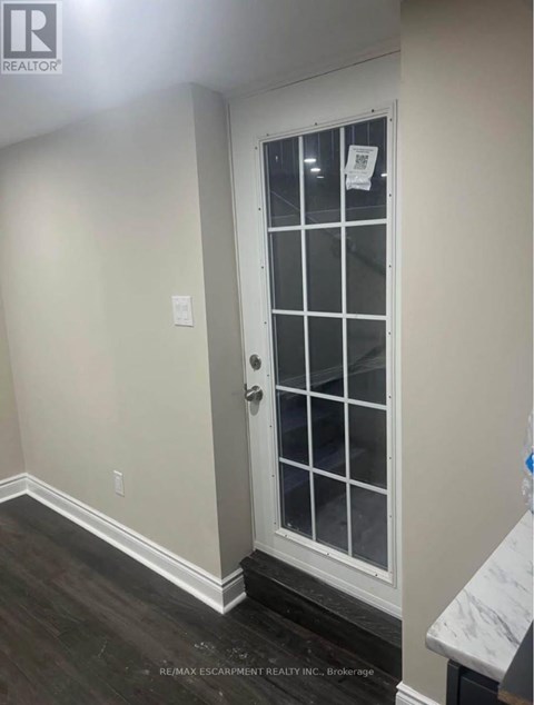 A white door with a glass panel and a handle.