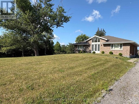 A house with a gravel path leading to the front door.