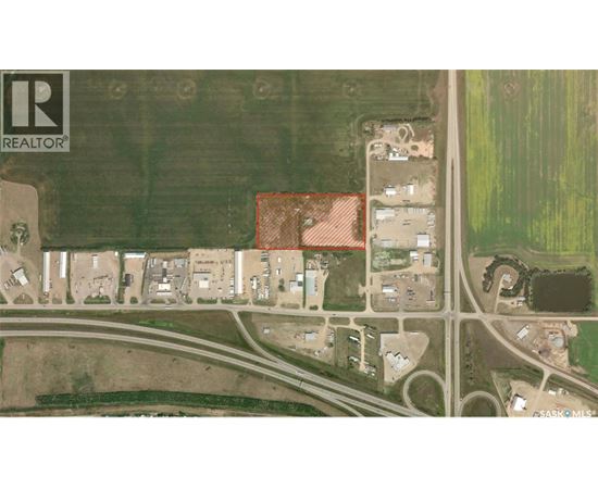 A satellite image of a real estate area with a red box highlighting a specific property.
