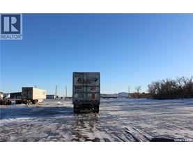A white box truck with the word "DRIVE" on the side is parked in a snowy lot.
