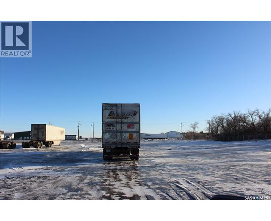 A white box truck with the word "DRIVE" on the side is parked in a snowy lot.