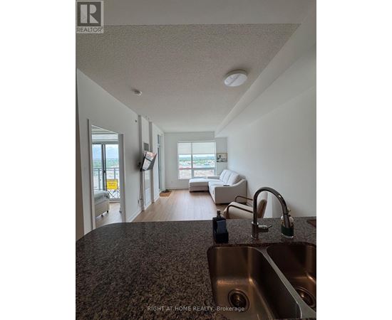 A kitchen with a sink and a window.