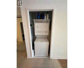 A white dishwasher and oven are installed in a small alcove.