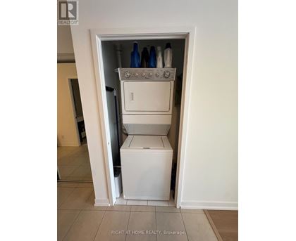 A white dishwasher and oven are installed in a small alcove.