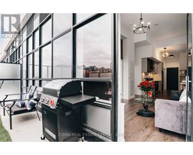 A modern living room with a barbecue grill and a view of the outdoors.
