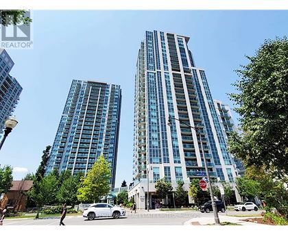 Two tall buildings are situated next to each other.
