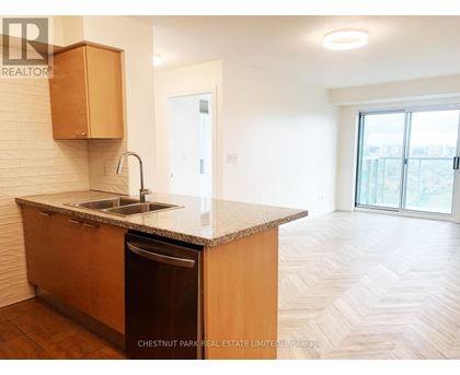 A kitchen with a sink and a dishwasher.