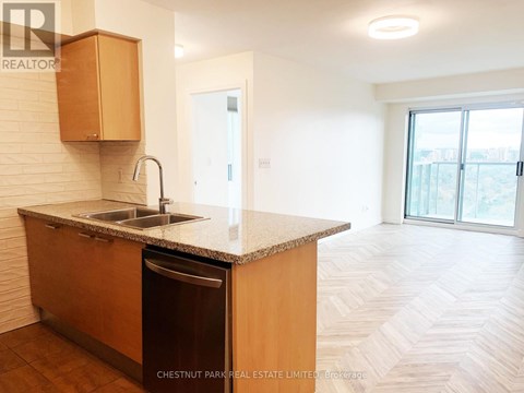 A kitchen with a sink and a dishwasher.