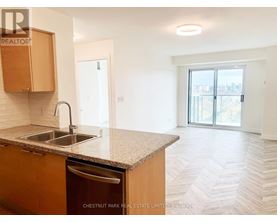 A kitchen with a sink and a dishwasher.