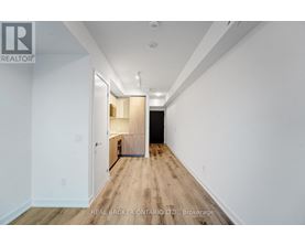 A long hallway with a door at the end.