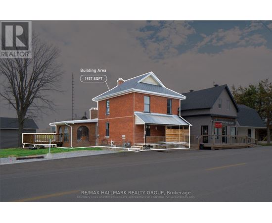 A house with a blue roof and a sign that says RE/MAX Hallmark Realty Group.