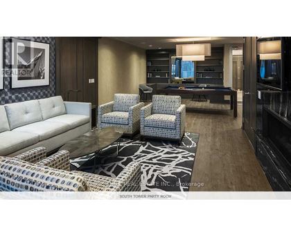 A party room with a pool table and a couch.
