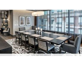A dining room with a table set for six.