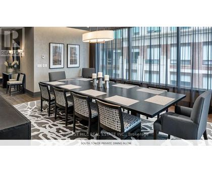 A dining room with a table set for six.
