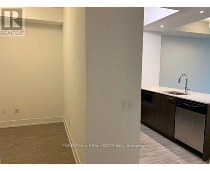 A kitchen area with a sink and a dishwasher.