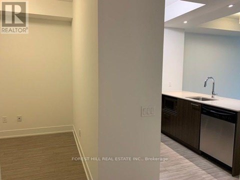 A kitchen area with a sink and a dishwasher.
