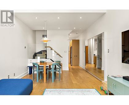 A dining room with a table and chairs is shown.