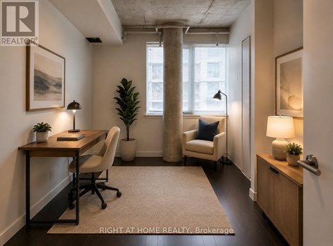 A well-lit office space with a desk, chair, and potted plant.