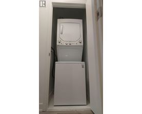 A white washing machine in a small space.