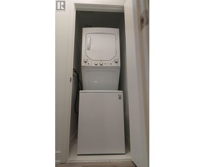 A white washing machine in a small space.