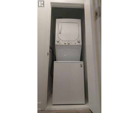 A white washing machine in a small space.