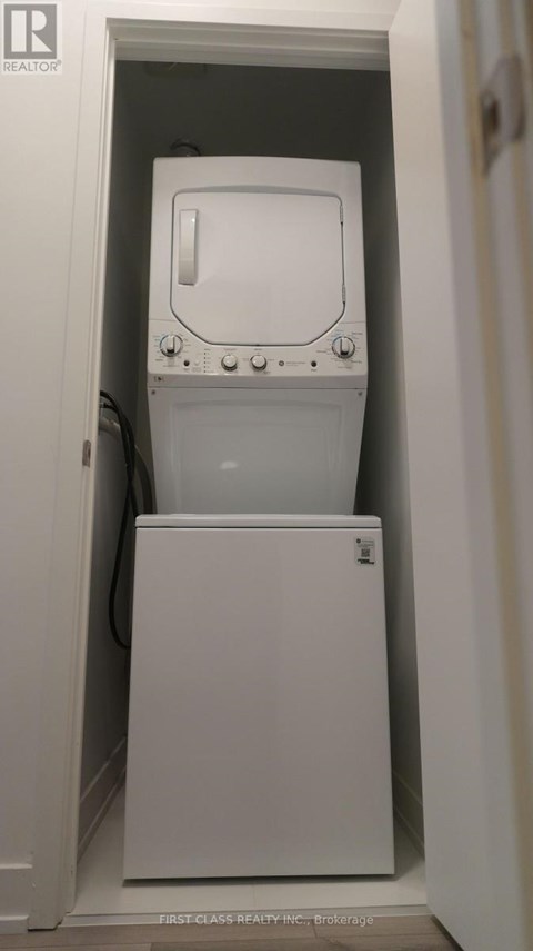 A white washing machine in a small space.