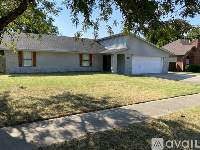 A house with a garage is for sale.
