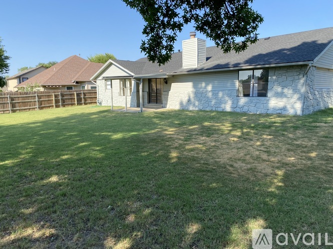 A house with a stone exterior is available for sale.