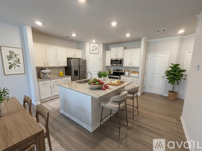 Two white doors in a room with wooden floors.