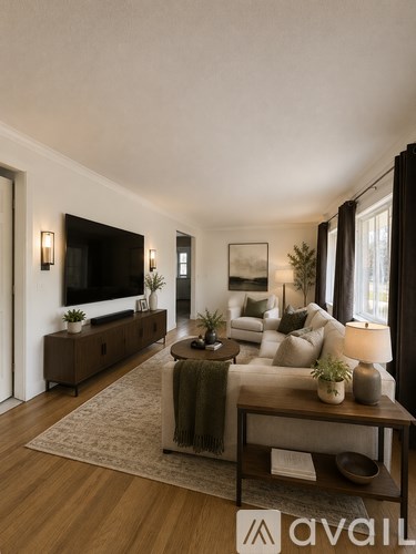 A living room with a brown sofa and a wooden coffee table.