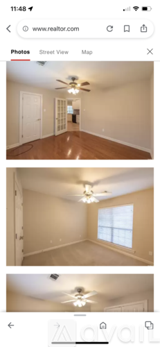 A room with a ceiling fan and a window.