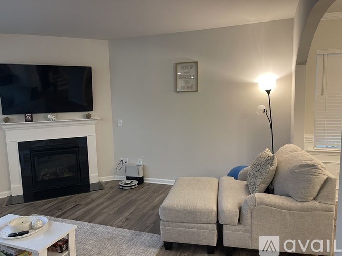 A living room with a fireplace and a couch.