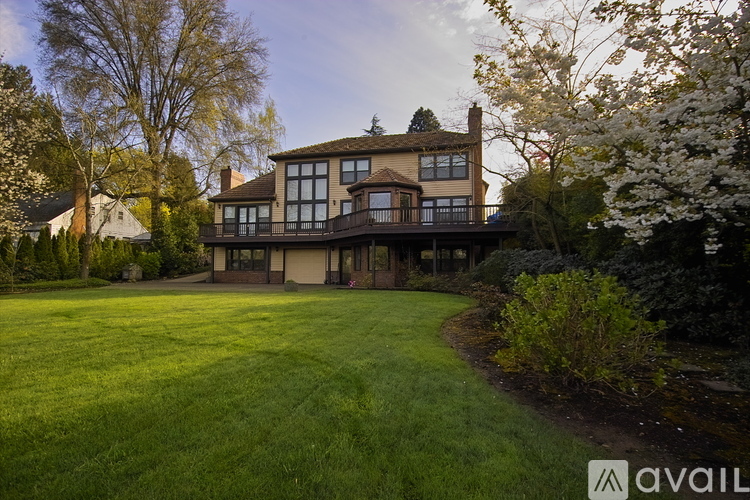 A large house with a lawn in front of it.