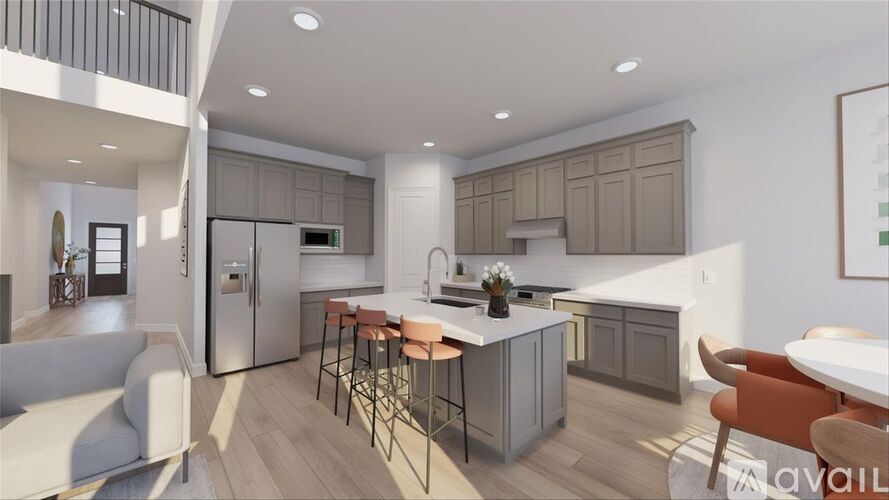 A modern kitchen with a dining table and chairs.