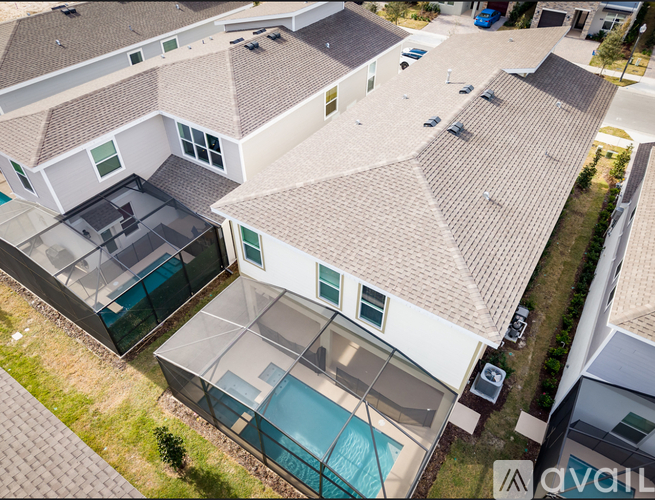 A house with a pool in the middle of it.