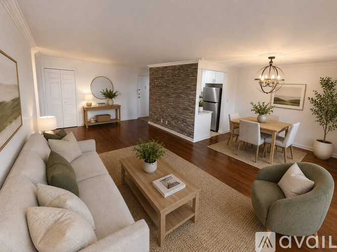 A living room with a grey couch, a coffee table, and a dining table with chairs.