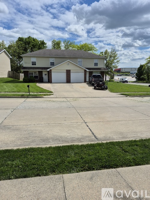 A house with a driveway in front of it.