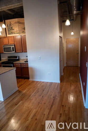 A kitchen with wooden floors and a counter top.