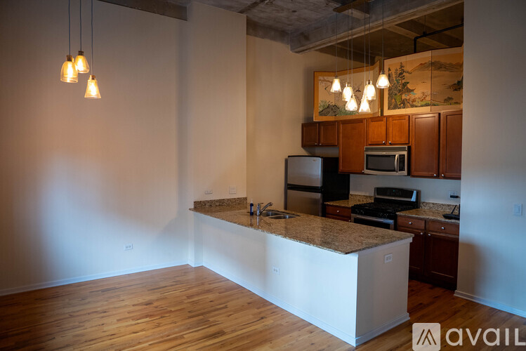 A kitchen with wooden cabinets and a white island.