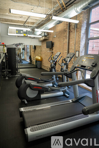 A gym with treadmills and exercise bikes.