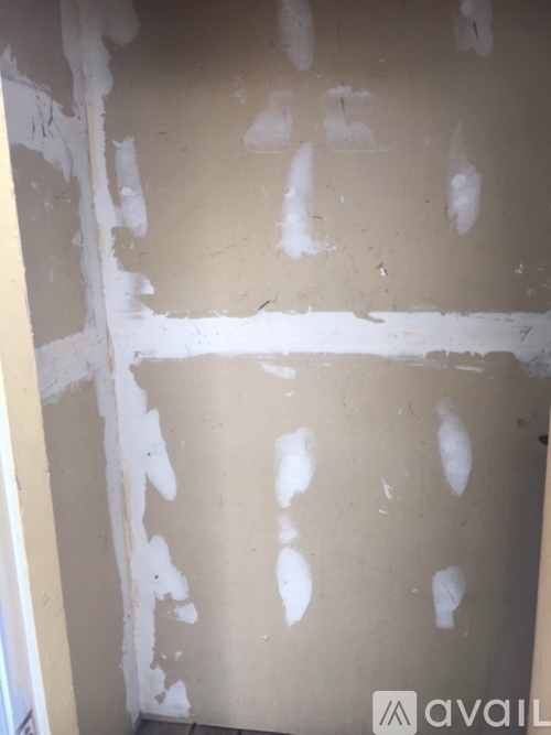 A wall with a lot of white paint on it.